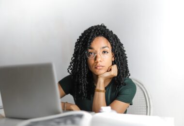 Person using the Iowa Secretary of State business search tool on a laptop