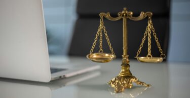 Business attorney near me discussing legal documents with a client