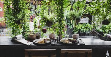 A vibrant Grecian restaurant setting with a variety of Mediterranean dishes, symbolizing strategic business elements like diversity, branding, and customer experience.