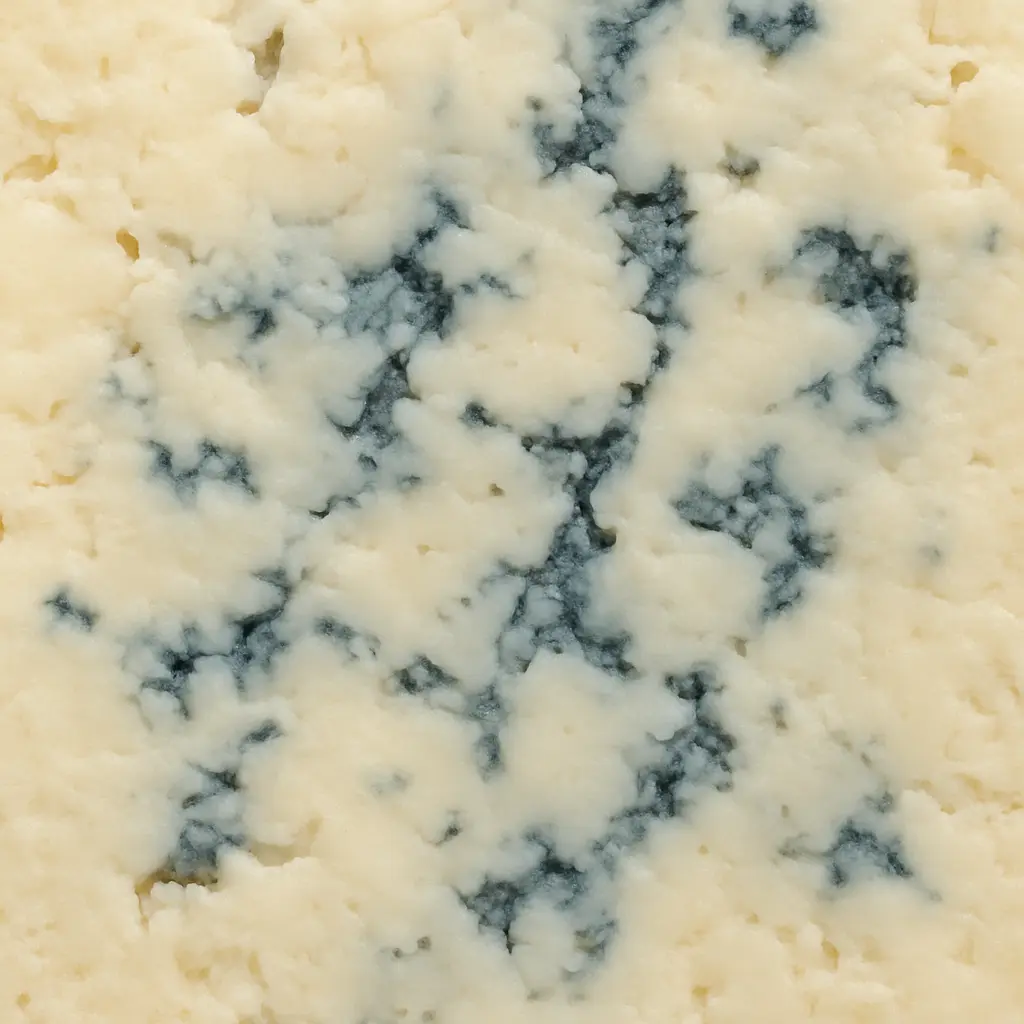 A wedge of Masgonzola cheese highlighting its blue veins and creamy texture.